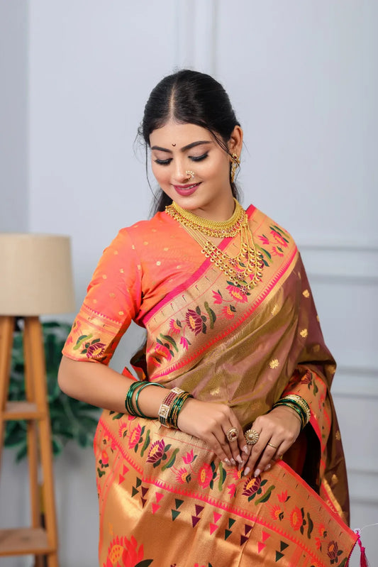 Traditional paithani saree look in brown silk with pink-golden tissue border, colorful floral and peacock motifs, styled with gold jewelry