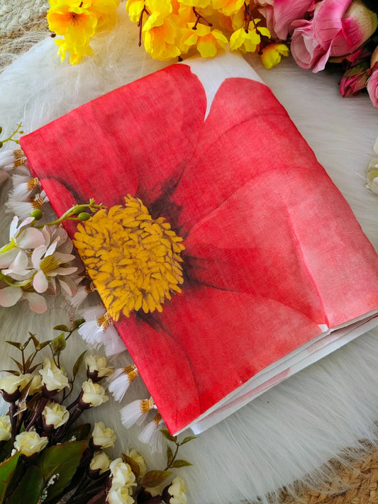 Beautiful woman wearing a white linen digital print saree with Red floral design