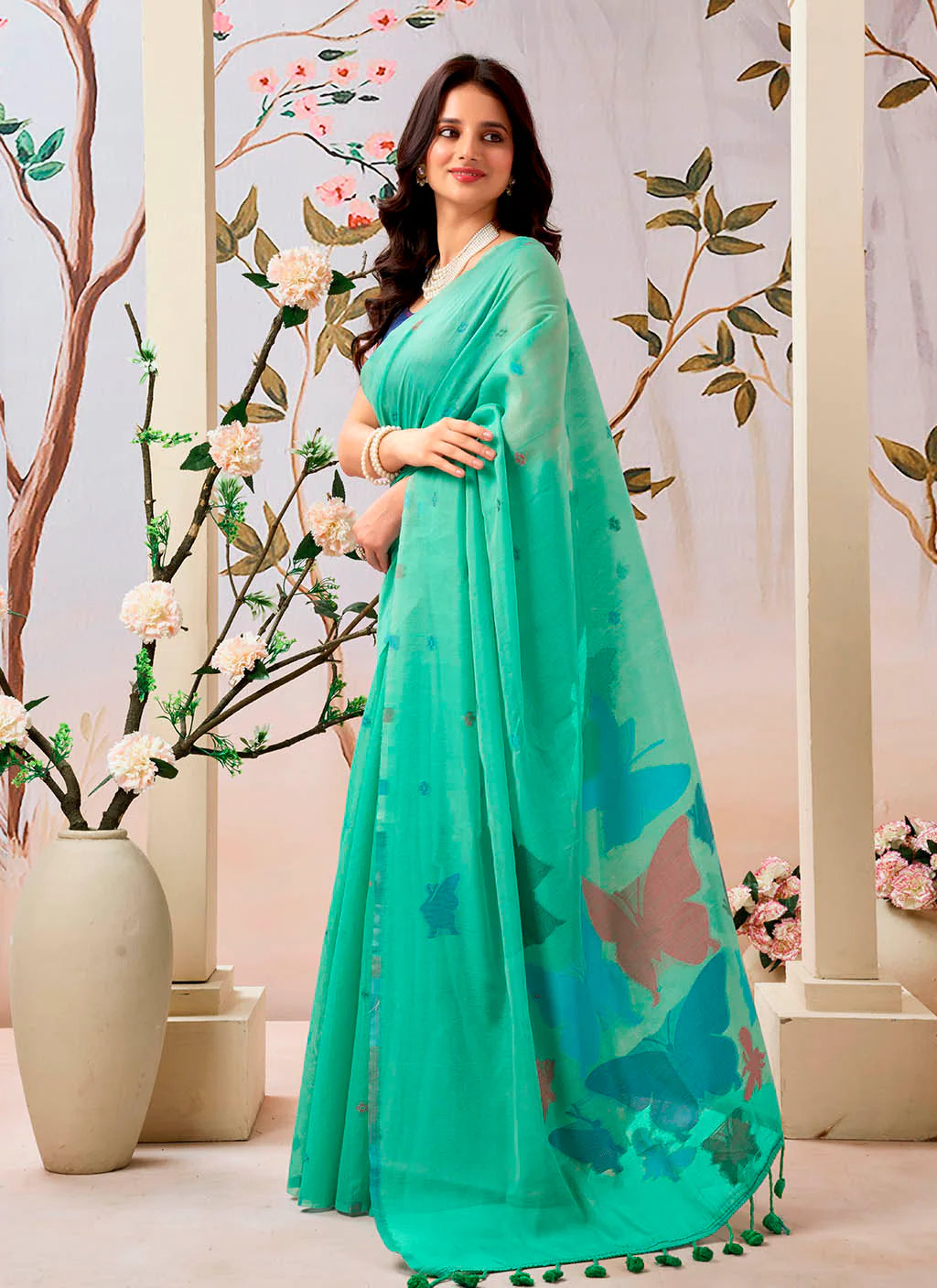 Woman wearing a pure Mul cotton saree showcasing its soft and lightweight fabric, ideal for comfortable daily wear.
