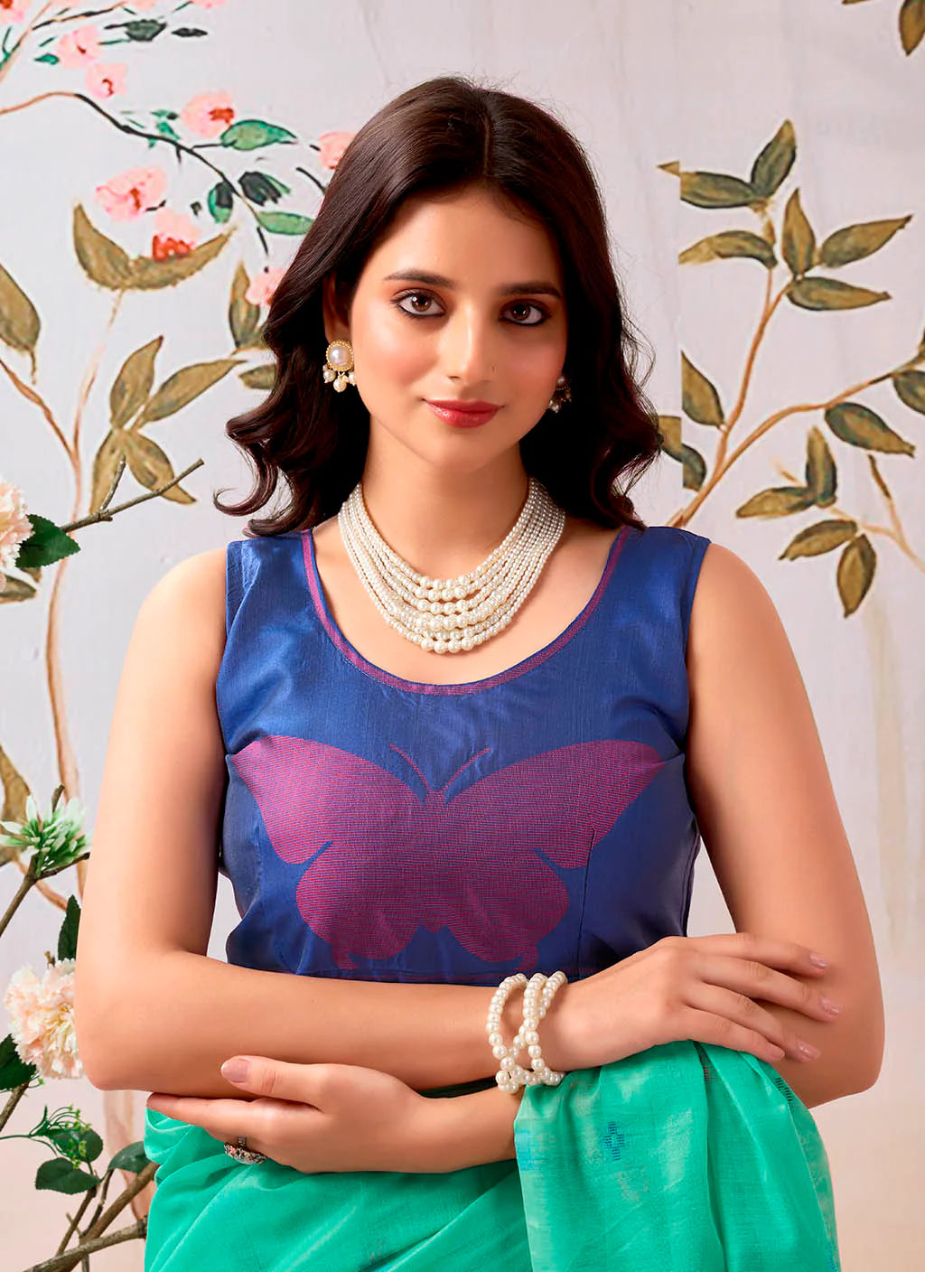 Woman wearing a pure Mul cotton saree showcasing its soft and lightweight fabric, ideal for comfortable daily wear.