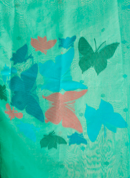 Woman wearing a pure Mul cotton saree showcasing its soft and lightweight fabric, ideal for comfortable daily wear.