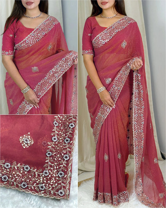 Shimmering tissue saree with intricate detailing, offering a lightweight and elegant look for special occasions.