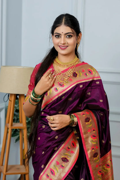 Close-up paithani saree look featuring wine purple handwoven silk with golden tissue border and multi-layered gold necklace styling
