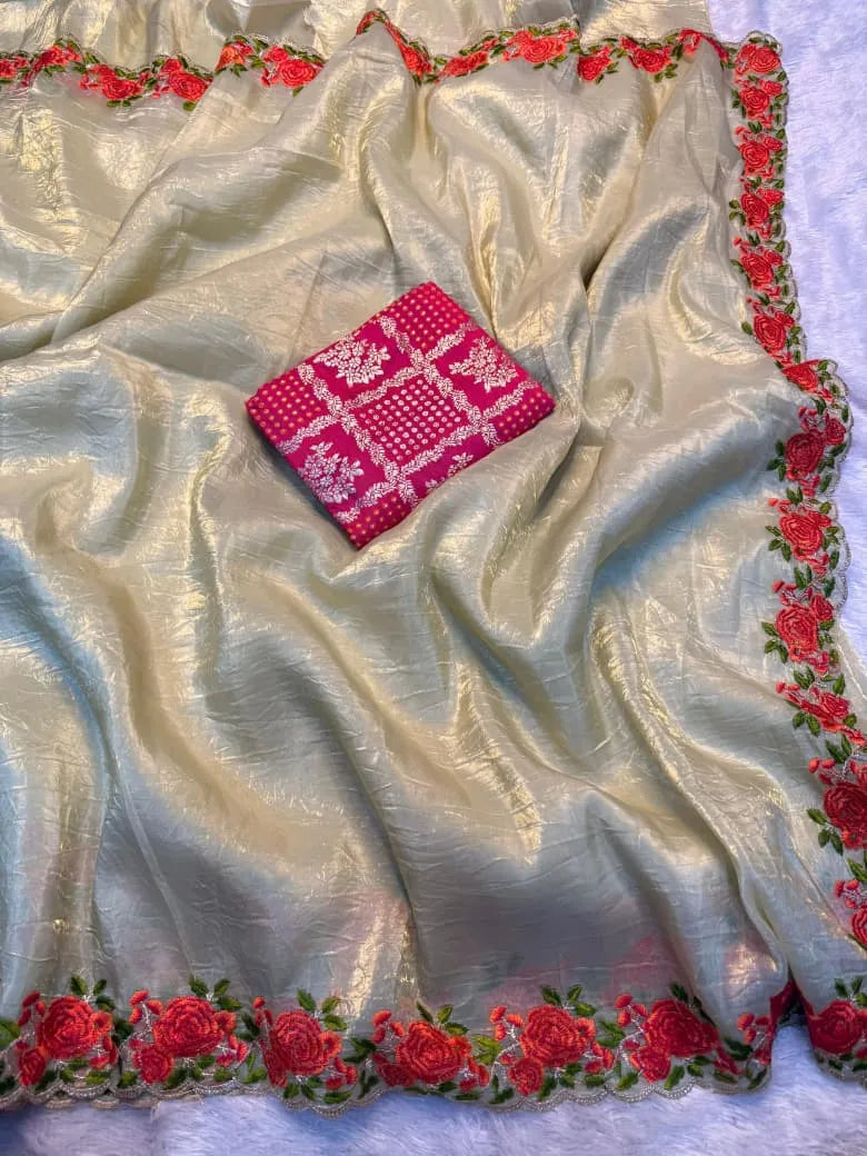 Yellow crunchy silk saree featuring colorful floral embroidered borders with rose motifs and scalloped edges