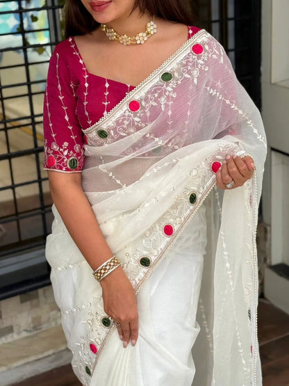 White crush saree with embroidered net overlay and designer magenta blouse featuring mirror work border