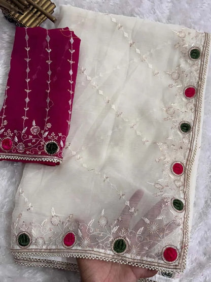 White crush saree with embroidered net overlay and designer magenta blouse featuring mirror work border