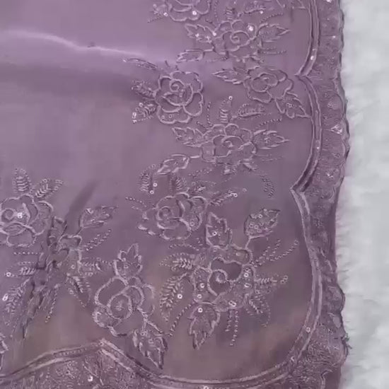 Elegant cream embroidered saree with floral lace border, paired with magenta blouse, ideal for festive and traditional occasions.