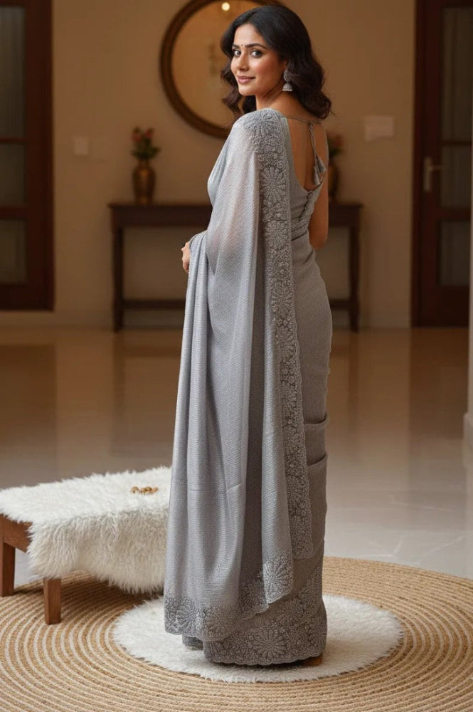 Beautiful woman wearing a chiffon georgette saree with a soft, flowy texture and elegant design, ideal for festive and party occasions.
