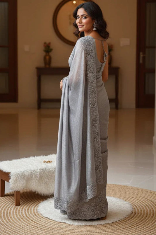 Beautiful woman wearing a chiffon georgette saree with a soft, flowy texture and elegant design, ideal for festive and party occasions.